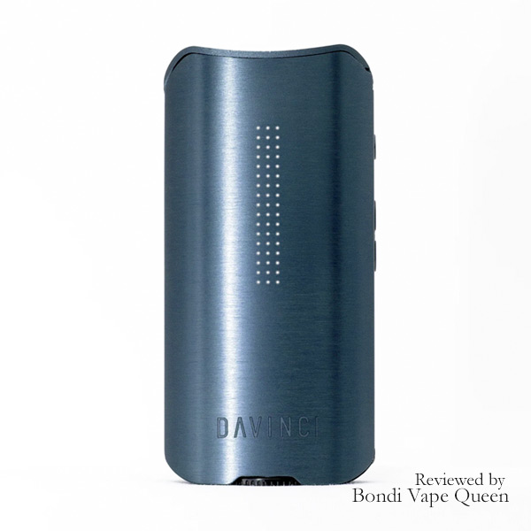 A sleek, cobalt-colored portable vaporizer device by DAVINCI, designed for vaporizing dry herbs and extracts. The device features a digital display and customizable temperature control